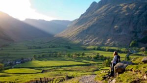 Sunlit valley and hillwalker; English Lake District, U.K